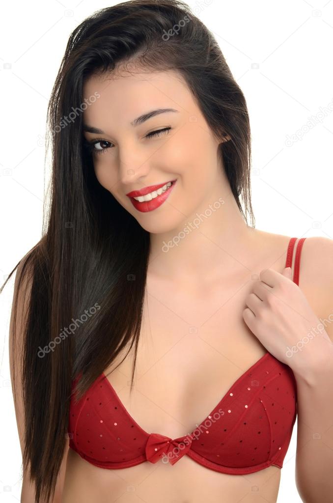 Sexy woman in red bra winking.