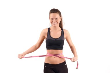 güzel kızın beline bir pembe bant santimetre ölçme ile ölçüm Sığdır.