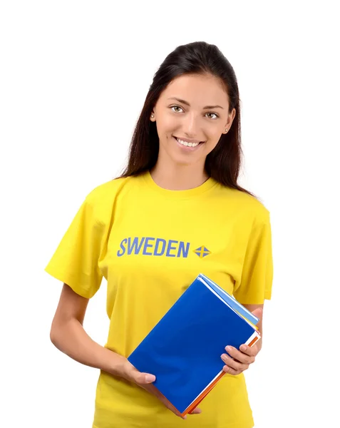 Beautiful student with Sweden flag on the yellow blouse holding books — Stock Photo, Image