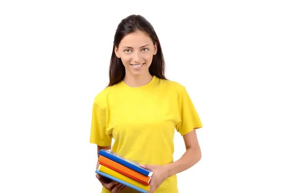 Estudante bonita em blusa amarela segurando livros . — Fotografia de Stock