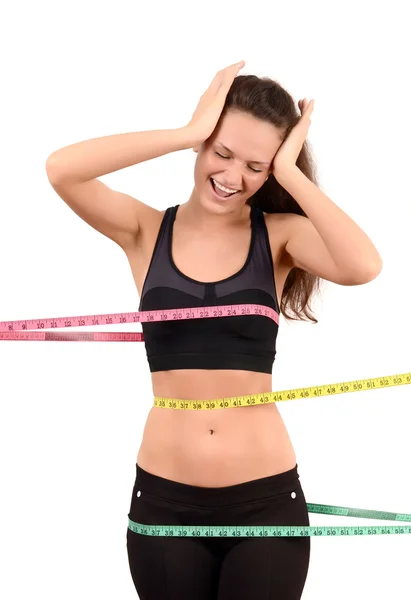 Beautiful fit girl with measuring tape around her bust, waist and hips. — Stock Photo, Image