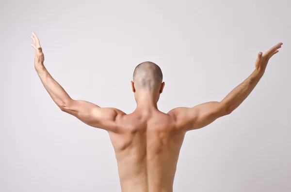 Topless dancer, man stripper posing with his back and arms up opened. — Stock Photo, Image