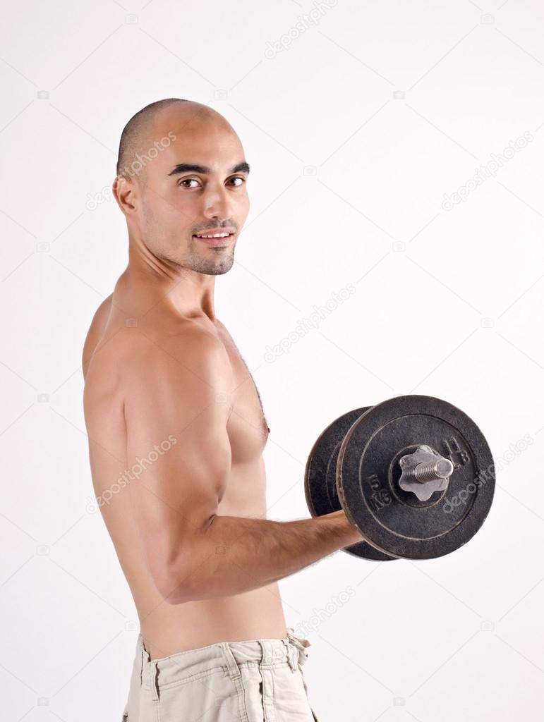 Strong man lifting weights for the biceps.