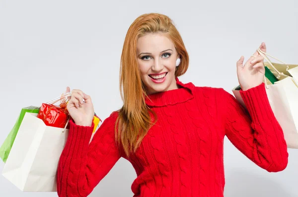 Happy young woman shopping for the Christmas holidays. — Stock Photo, Image