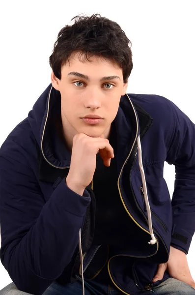 Young man with the hand on the chin looking serious. — Stock Photo, Image