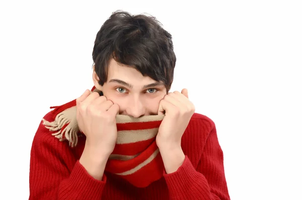 Handsome man dressed for a cold winter being cold, puling his scarf on the face. — Stock Photo, Image