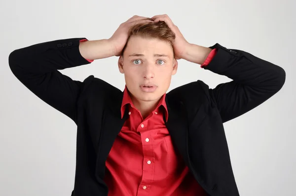 Worry, sadness, desperation. Young business man holding his head frowning with worry. — Stock Photo, Image