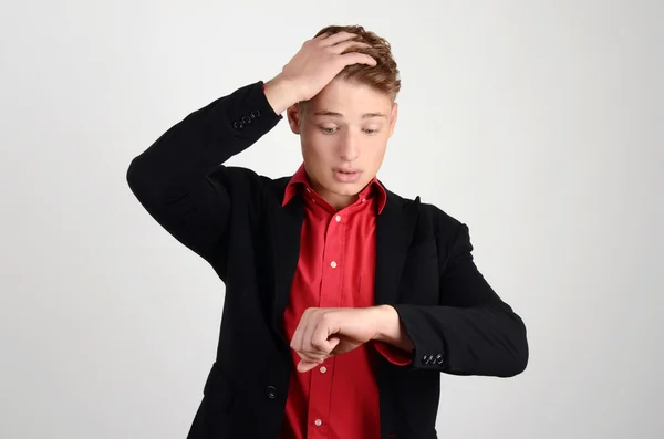 Business time. Businessman looking at his imaginary wristwatch worrying, being late concept. — Stock Photo, Image