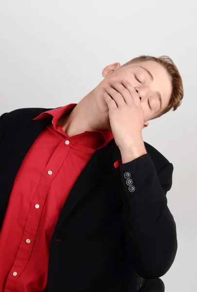 Tired business man yawning sleeping in the executive chair. — Stock Photo, Image