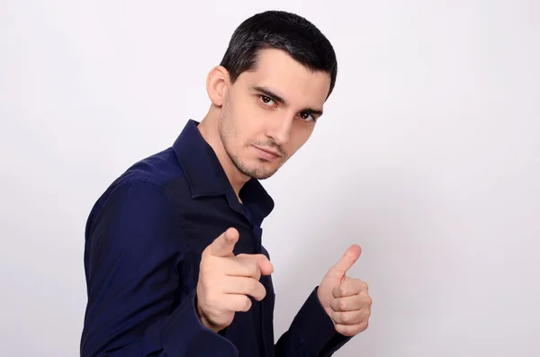 Man pointing in front at you and signing thumbs up. — Stock Photo, Image