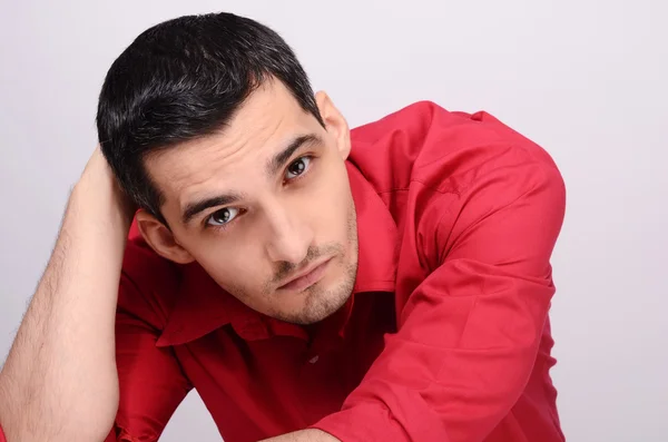 Handsome man posing looking up at the camera. — Stock Photo, Image