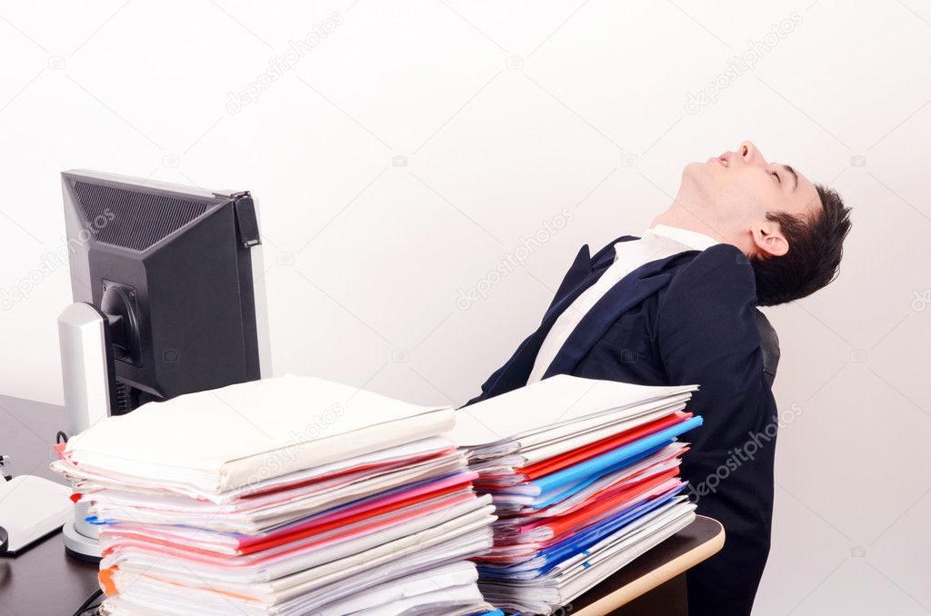 Tired business man sleeping at work.