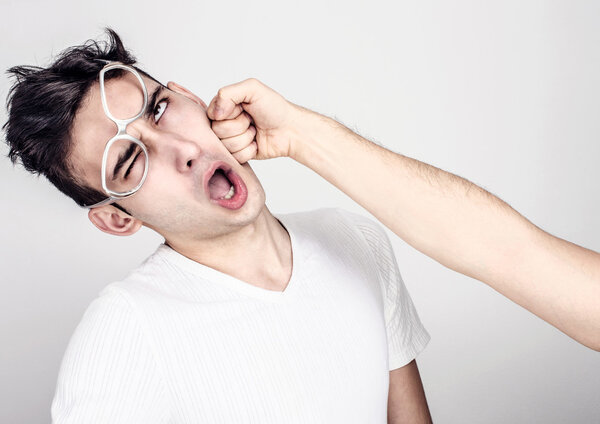 Молодой человек получил удар в челюсть
.