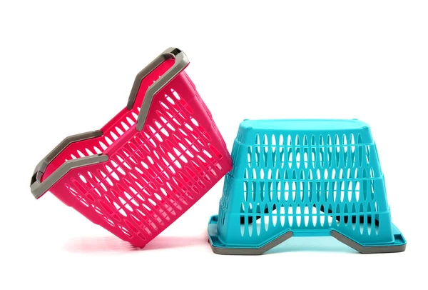 Blue and pink plastic shopping basket isolated on white. — Stock Photo, Image