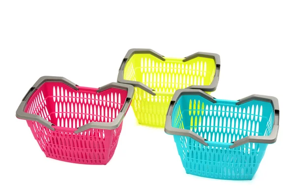 Blue, yellow and pink plastic shopping basket isolated on white. — Stock Photo, Image