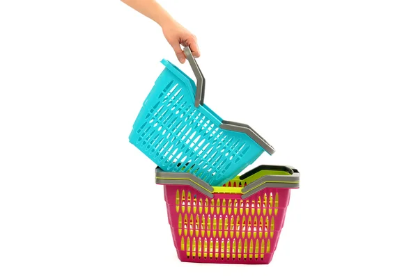 Woman hand taking a shopping basket from a pile. — Stock Photo, Image