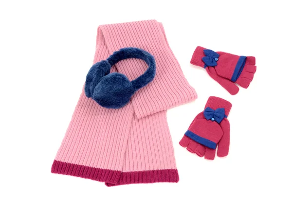 Pink wool scarf, a pair of gloves and earmuffs nicely arranged. — Stock Photo, Image