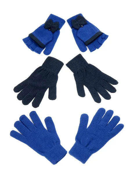 Drie paar donker blauwe handschoenen. — Stockfoto