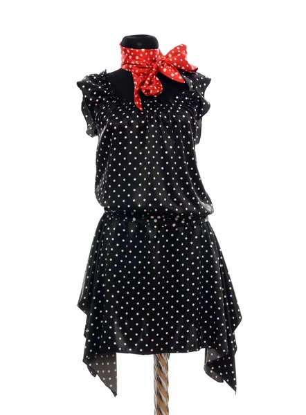 Polka pontos vestido com cachecol vermelho no manequim . — Fotografia de Stock