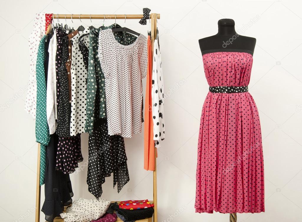 Dressing Closet With Polka Dots Clothes Arranged On Hangers And A