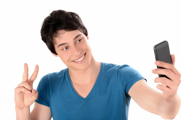 Happy young man taking a selfie photo signing victory with his smart phone. — Stock Photo, Image