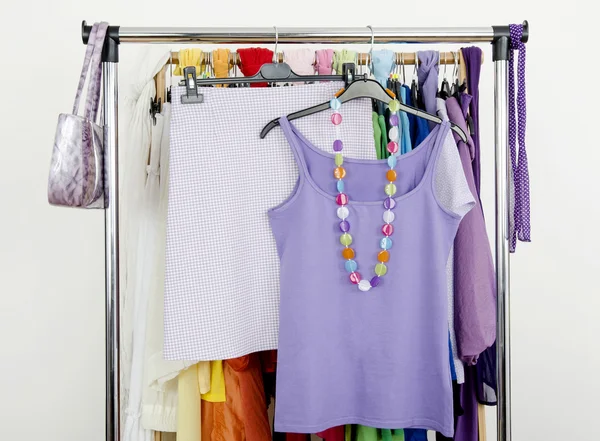 Cute purple outfit displayed on a rack. — Stock Photo, Image