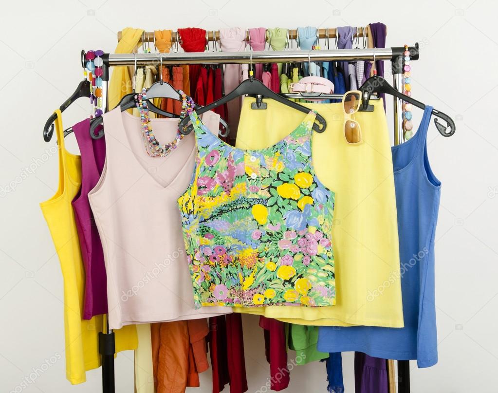 Cute summer tank tops displayed on a rack.