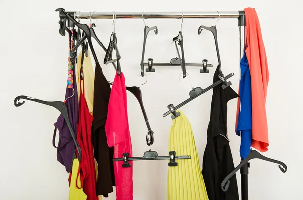 Messy rack of clothes and hangers. — Stock Photo, Image