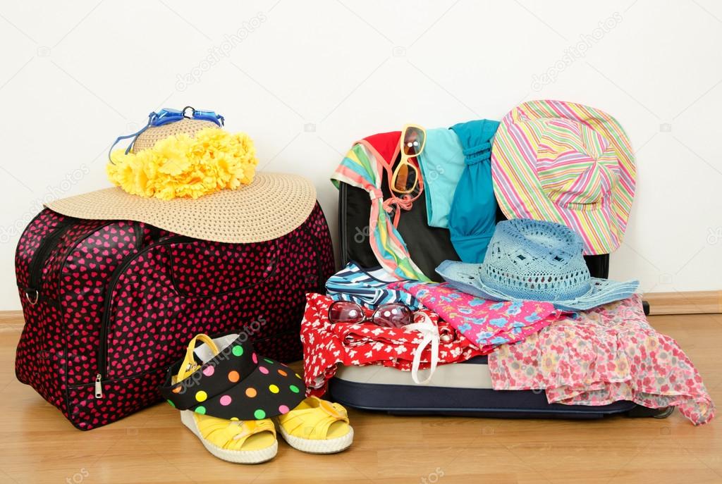 Packing the suitcase for summer vacation.