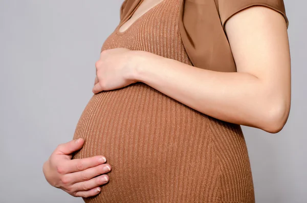 Fechar na barriga grávida . — Fotografia de Stock