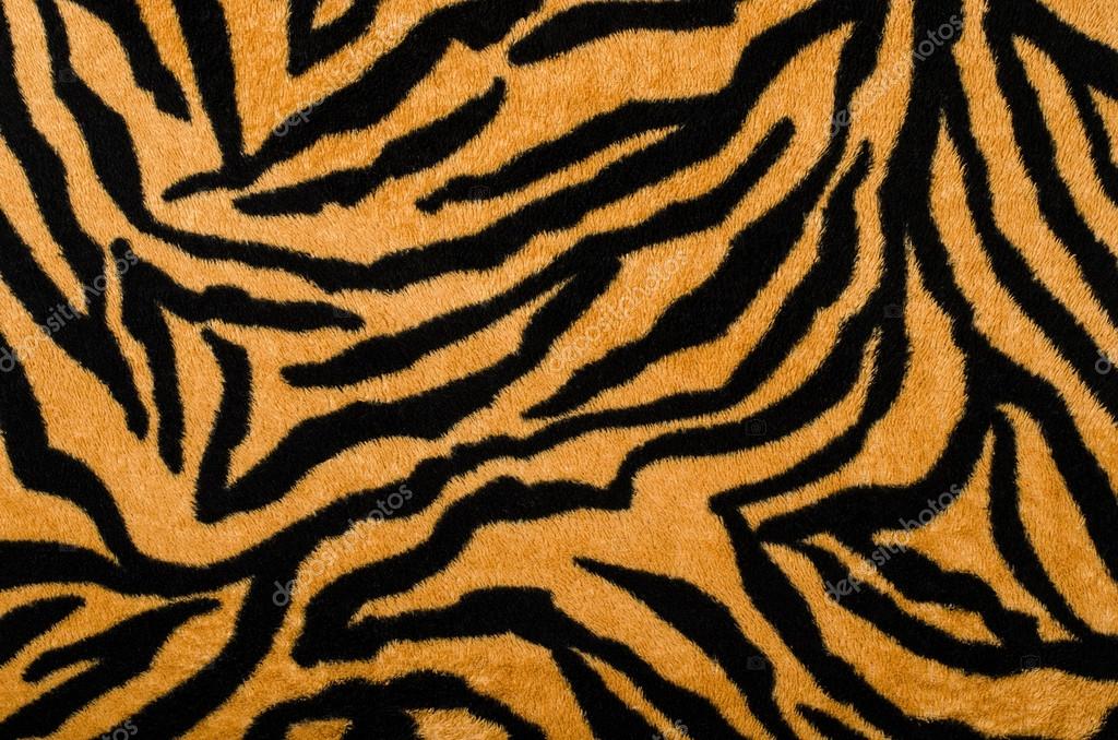 Brown and black tiger pattern. Fur animal print as background. — Stock