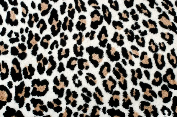 Brunt och svart leopardmönster. pälsfodrar djur print som bakgrund. — Stockfoto