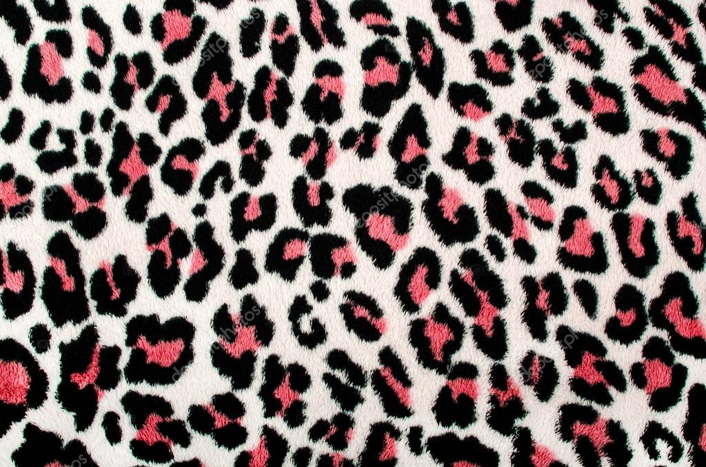 Spotted fur animal print as background. 