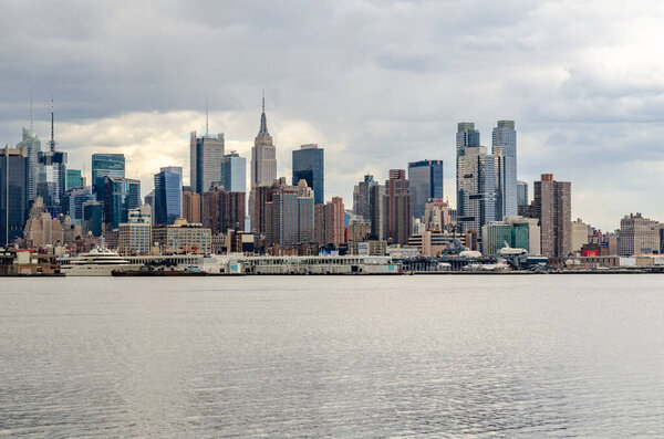 View of Manhattan Skyline, New York City with Hudson river in front