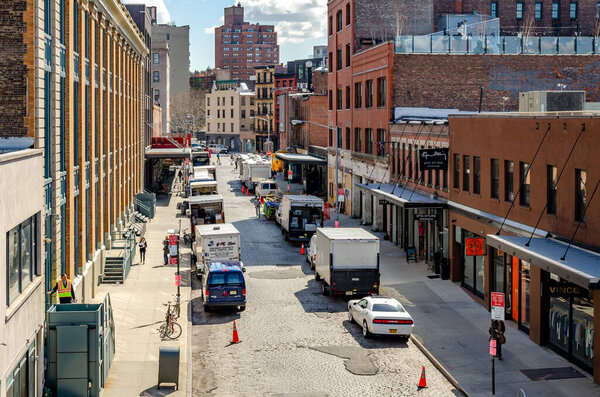 Chelsea City Street with lots of parked trucks, aerial view, New York City