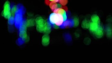 Odak dışı çok renkli bulanık ışık arka planı. Soyut hareket dairesi ışıklarını döndür