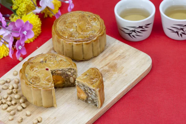 Moon cake with nuts and yolk inside — Stock Photo, Image