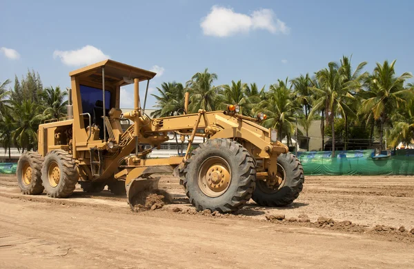 Motor grader working on road construction — Stock Photo, Image