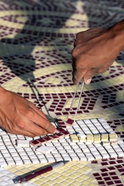 The installing mosaic ceramic tiles clipart