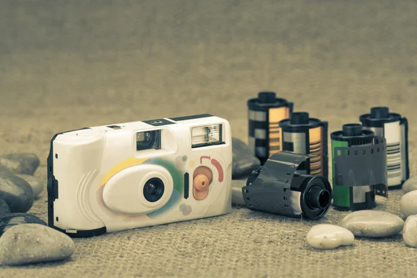 Retro film camera and film cartridge — Stock Photo, Image
