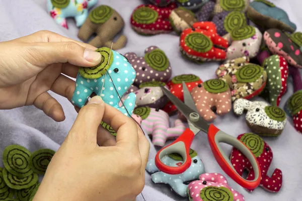 Hand sewing elephant cloth dolls — Stock Image Hand sewing elephant cloth dolls Royalty Free Stock Images