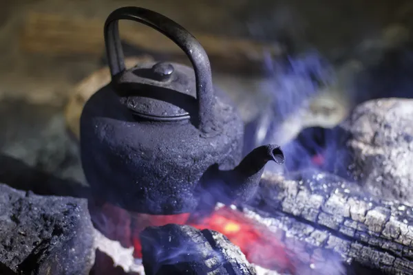 Old kettle at campfire — Stock Photo, Image