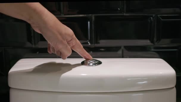 Senior Woman Hand Flushing Toilet — Stock Video