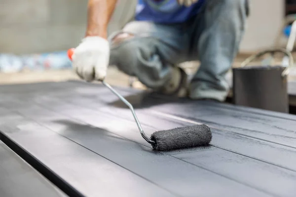 Worker Painting Steel Post Construction Site — стоковое фото