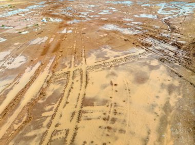 Construction sites fill dirt to raise the ground level and reduce the chances of flooding.
