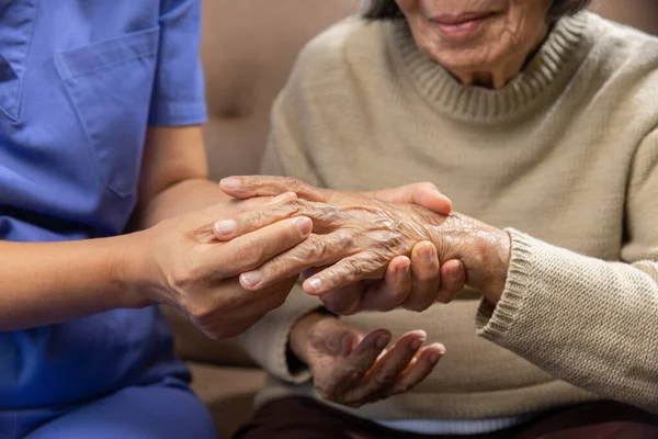 Caregiver Massaging Wrist Elderly Woman Painful Swollen Gout — Stock Photo, Image