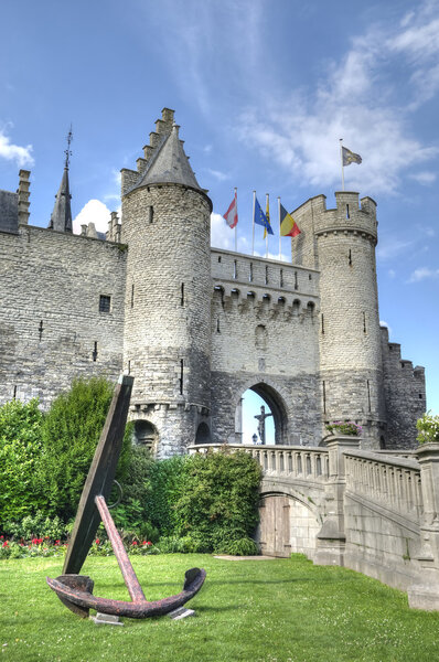 Entry in Steen castle in Antwerp in clear summer day with clouds