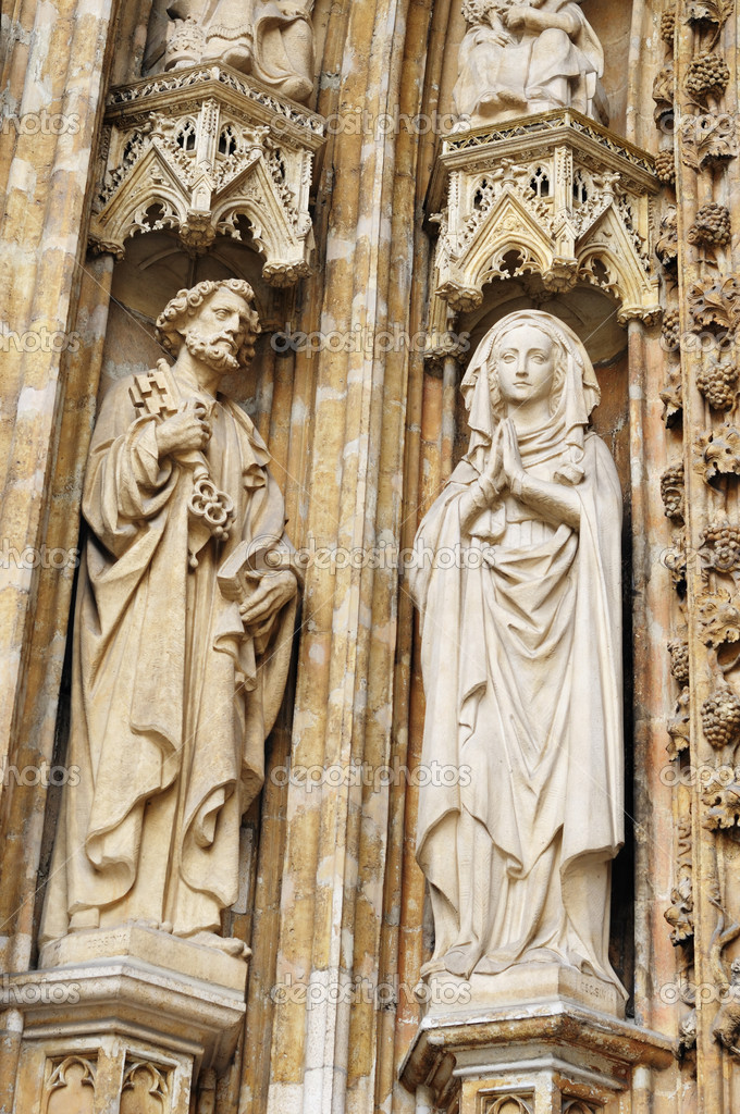Medieval statues on entry in catholic church Petit Sablon in Brussels