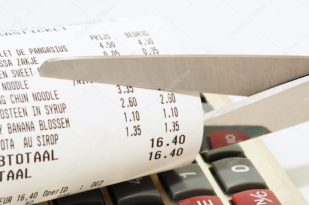 Economy concept with scissors cutting receipt from shop