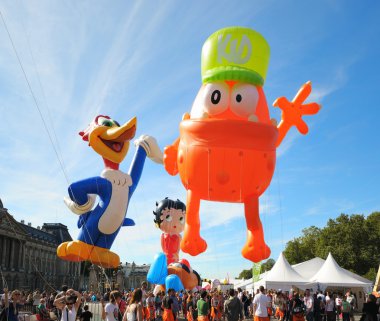 BRUSSELS, BELGIUM-SEPTEMBER 8: Defile of giant cartoon characters in Balloons Day Parade departs from Place des Palais on September 8, 2012 in Brussels. clipart